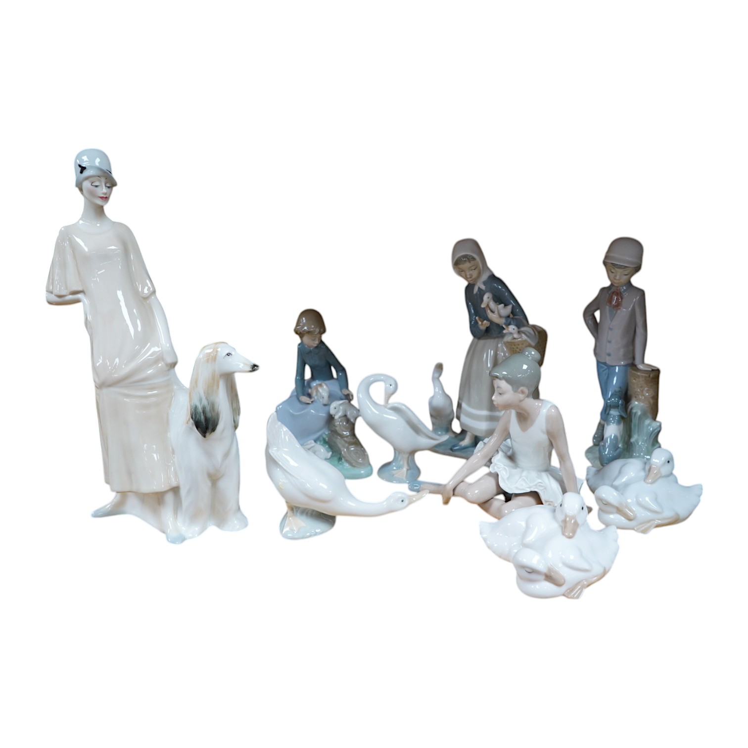 A Royal Doulton figure ‘Promenade’ HN3072, and a group of eight Lladro/Nao figures, largest 33cm high. Condition - good